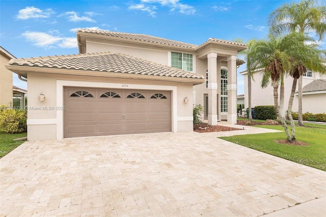 2256 SW 183rd Ter, Miramar, FL 33029 - mediterranean / spanish home featuring decorative driveway, an attached garage, stucco siding, and a tile roof
