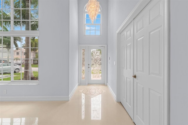 2256 SW 183rd Ter, Miramar, FL 33029 - entrance foyer featuring a chandelier, baseboards, and a towering ceiling
