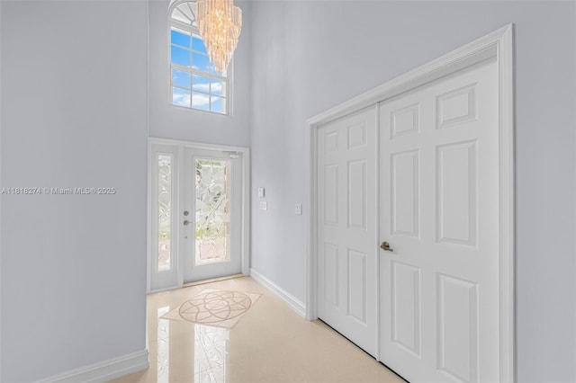 2256 SW 183rd Ter, Miramar, FL 33029 - foyer entrance with a chandelier, baseboards, and a towering ceiling