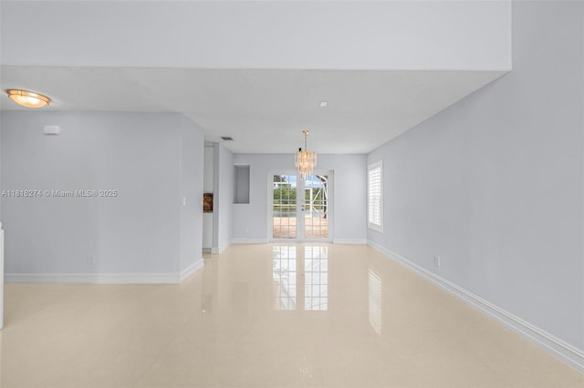 2256 SW 183rd Ter, Miramar, FL 33029 - spare room featuring a chandelier and baseboards