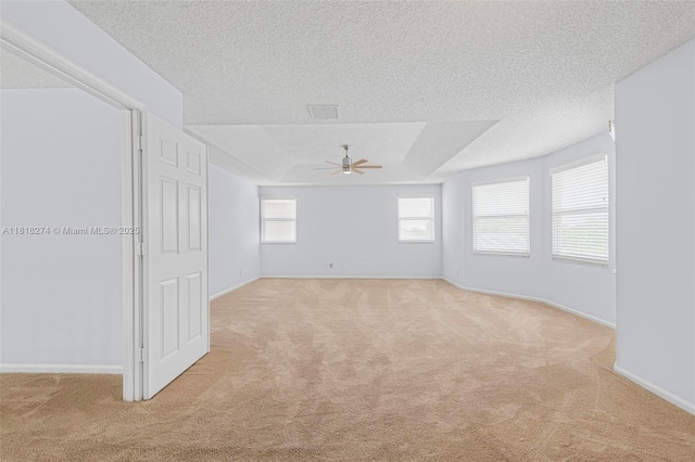 2256 SW 183rd Ter, Miramar, FL 33029 - spare room with light colored carpet, ceiling fan, a textured ceiling, and baseboards