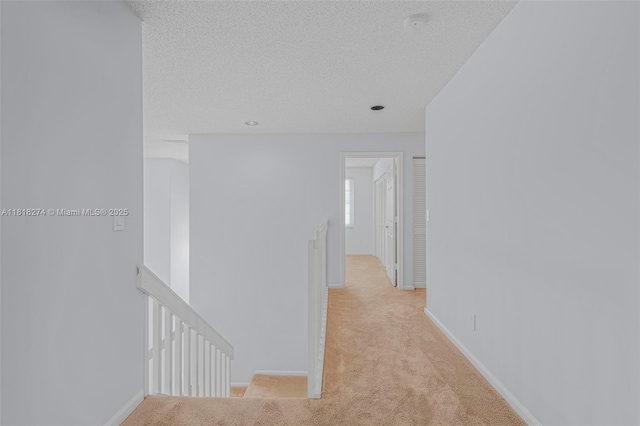 2256 SW 183rd Ter, Miramar, FL 33029 - corridor with an upstairs landing, carpet, a textured ceiling, and baseboards