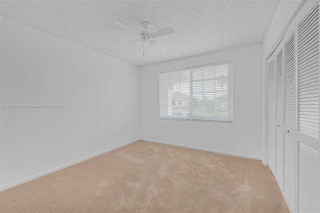 2256 SW 183rd Ter, Miramar, FL 33029 - unfurnished bedroom with a textured ceiling, a closet, light carpet, baseboards, and ceiling fan