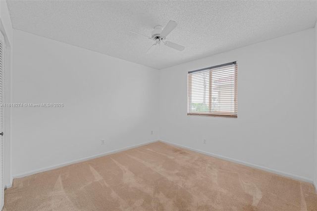 2256 SW 183rd Ter, Miramar, FL 33029 - empty room featuring light carpet, a textured ceiling, a ceiling fan, and baseboards
