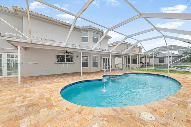 2256 SW 183rd Ter, Miramar, FL 33029 - swimming pool featuring a patio, french doors, a ceiling fan, and a jacuzzi