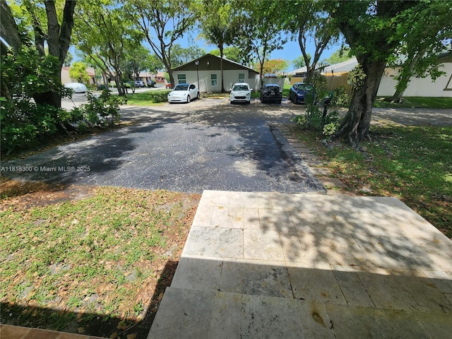 11820 SW 125th Pl Unit 11820, Miami, FL 33186 - view of asphalt driveway with a residential view