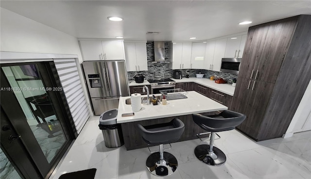 11820 SW 125th Pl Unit 11820, Miami, FL 33186 - kitchen with appliances with stainless steel finishes, wall chimney range hood, decorative backsplash, modern cabinets, and recessed lighting