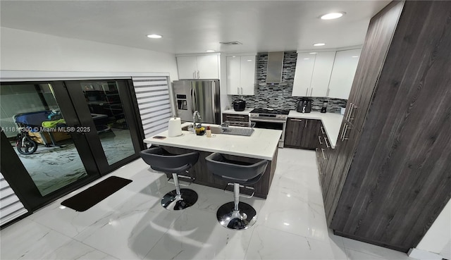 11820 SW 125th Pl Unit 11820, Miami, FL 33186 - kitchen featuring appliances with stainless steel finishes, light marble finish floors, modern cabinets, white cabinetry, and recessed lighting