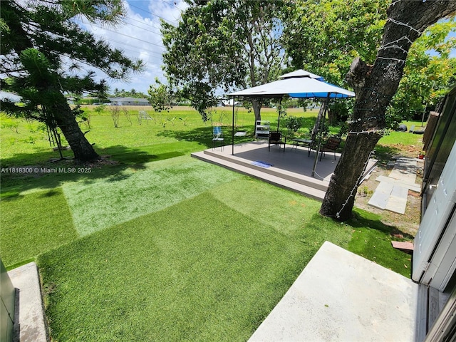 11820 SW 125th Pl Unit 11820, Miami, FL 33186 - view of grassy yard with a gazebo and a patio area