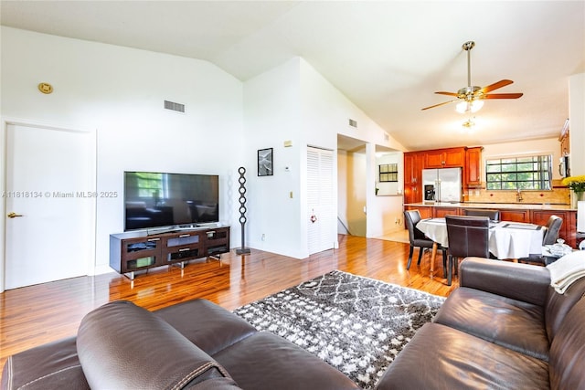 1412 Congressional Way Unit 1412, Deerfield Beach, FL 33442 - living area with a ceiling fan, light wood-type flooring, and high vaulted ceiling