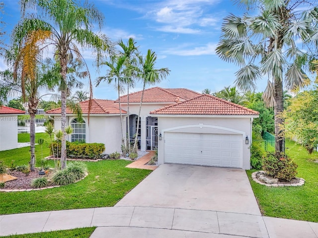 2775 Dunwoodie Pl, Homestead, FL 33035 - mediterranean / spanish home with stucco siding, a garage, a front yard, driveway, and a tiled roof