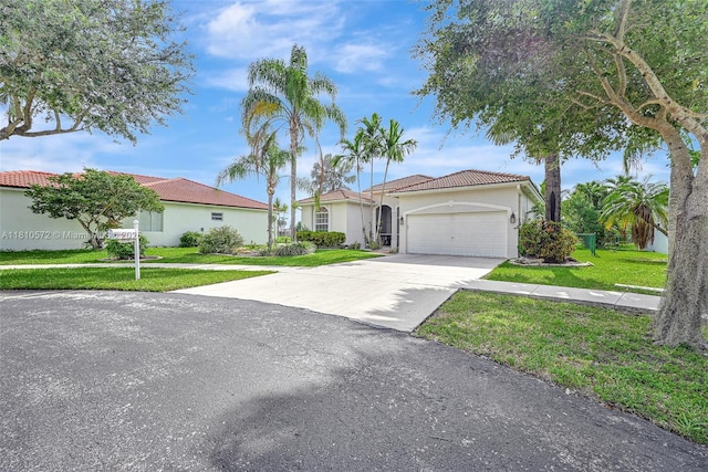 2775 Dunwoodie Pl, Homestead, FL 33035 - view of front of home featuring stucco siding, an attached garage, a tile roof, a front yard, and driveway