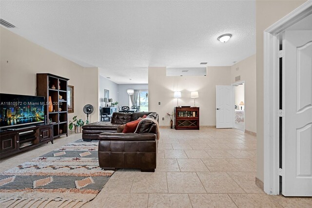 2775 Dunwoodie Pl, Homestead, FL 33035 - living area featuring a textured ceiling and baseboards