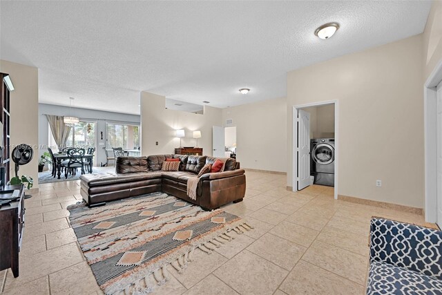 2775 Dunwoodie Pl, Homestead, FL 33035 - living area with washer / dryer, a textured ceiling, and baseboards