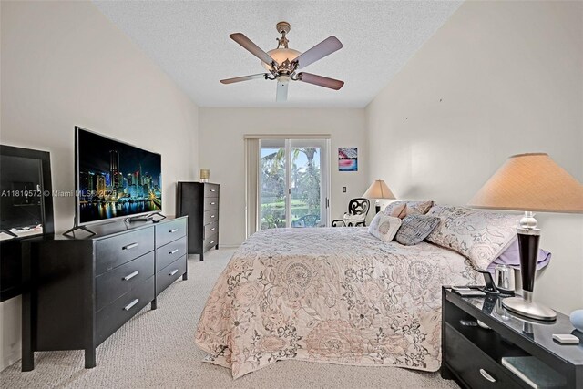 2775 Dunwoodie Pl, Homestead, FL 33035 - bedroom with light carpet, access to exterior, a textured ceiling, and a ceiling fan