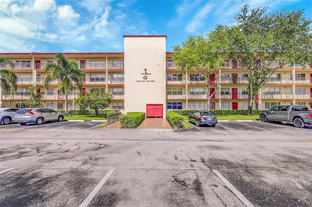 1551 SW 135th Ter Unit 112G, Pembroke Pines, FL 33027 - view of apartment building / complex featuring uncovered parking