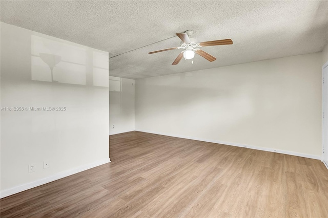 1551 SW 135th Ter Unit 112G, Pembroke Pines, FL 33027 - spare room with ceiling fan, a textured ceiling, and light wood-type flooring