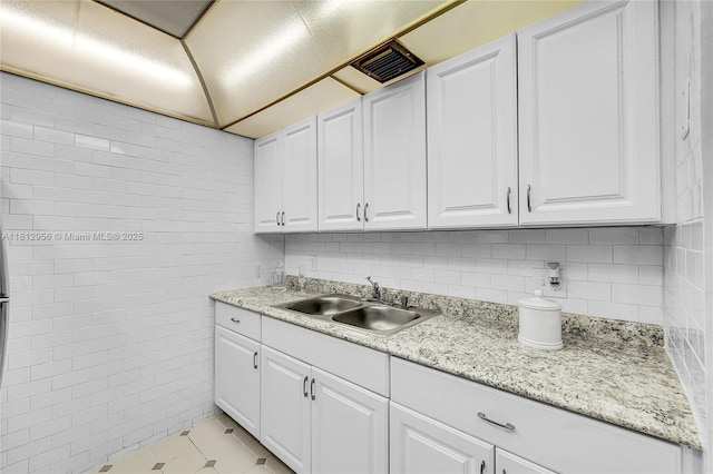 1551 SW 135th Ter Unit 112G, Pembroke Pines, FL 33027 - kitchen featuring tile walls, white cabinets, and light tile patterned floors