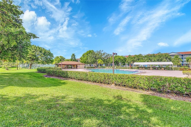1551 SW 135th Ter Unit 112G, Pembroke Pines, FL 33027 - view of grassy yard with a community pool