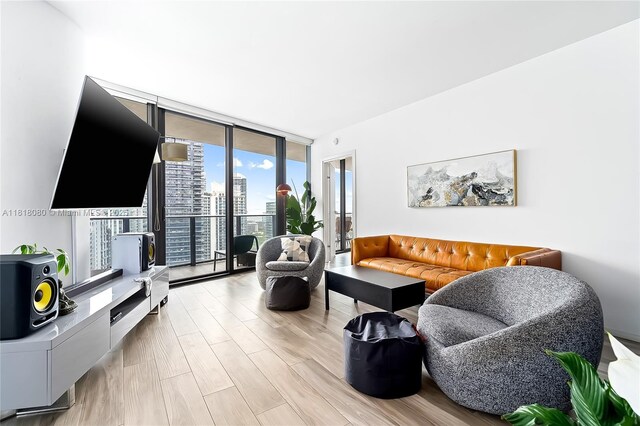 801 S Miami Ave Unit 3704, Miami, FL 33130 - living room featuring a wall of windows and light wood finished floors
