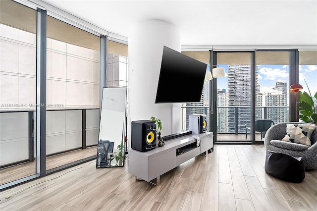 801 S Miami Ave Unit 3704, Miami, FL 33130 - living area with a wall of windows and light wood-style flooring