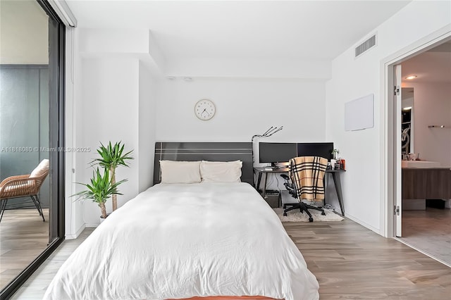 801 S Miami Ave Unit 3704, Miami, FL 33130 - bedroom with wood finished floors and a desk