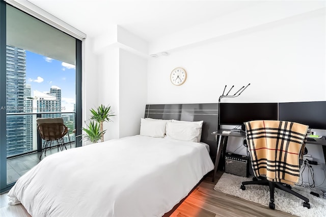 801 S Miami Ave Unit 3704, Miami, FL 33130 - bedroom featuring wood finished floors, a view of city, and expansive windows
