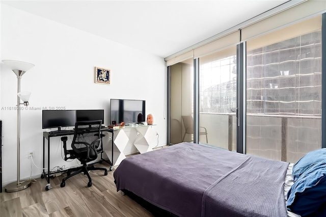801 S Miami Ave Unit 3704, Miami, FL 33130 - bedroom featuring wood finished floors and a desk