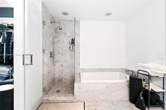 801 S Miami Ave Unit 3704, Miami, FL 33130 - bathroom featuring a garden tub, a stall shower, and a spacious closet
