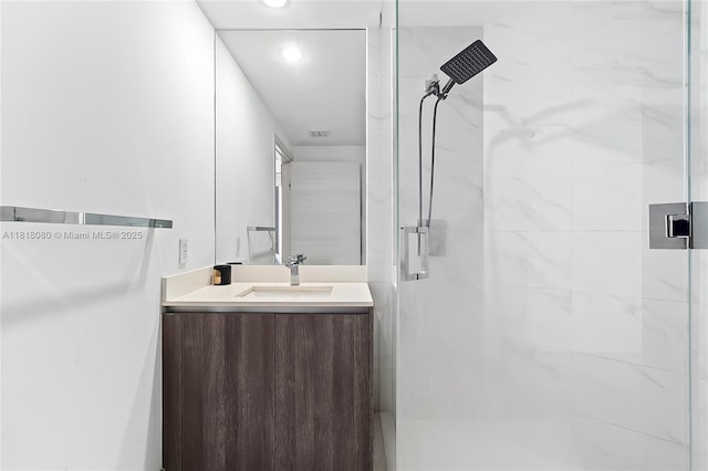 801 S Miami Ave Unit 3704, Miami, FL 33130 - bathroom featuring a marble finish shower, vanity, and recessed lighting