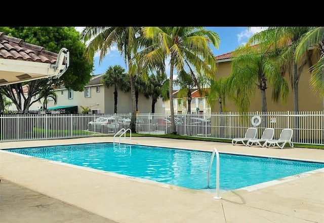 14085 SW 179th Ter, Miami, FL 33177 - community pool with a patio