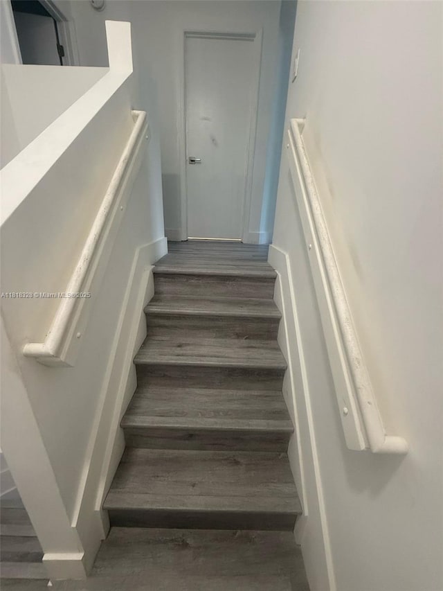 14085 SW 179th Ter, Miami, FL 33177 - stairs featuring wood finished floors and baseboards