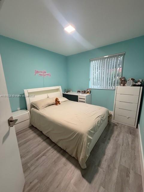 14085 SW 179th Ter, Miami, FL 33177 - bedroom featuring light wood-style floors