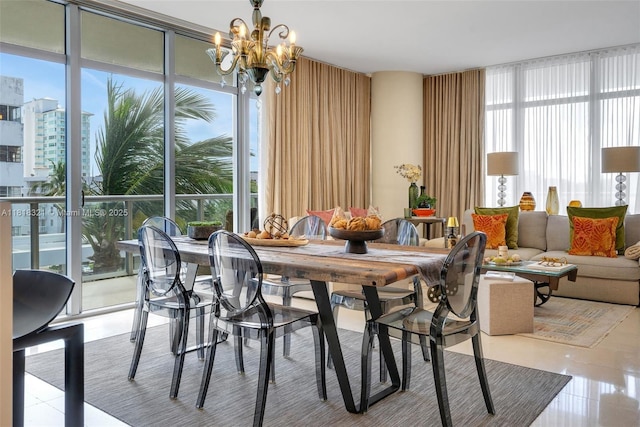 3737 Collins Ave Unit S-403, Miami Beach, FL 33140 - dining area featuring plenty of natural light, a chandelier, a wall of windows, and tile patterned flooring