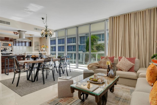 3737 Collins Ave Unit S-403, Miami Beach, FL 33140 - tiled living room with a chandelier and floor to ceiling windows
