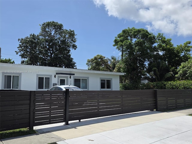 730 Alabama Ave, Fort Lauderdale, FL 33312 - single story home with a fenced front yard, stucco siding, and a gate