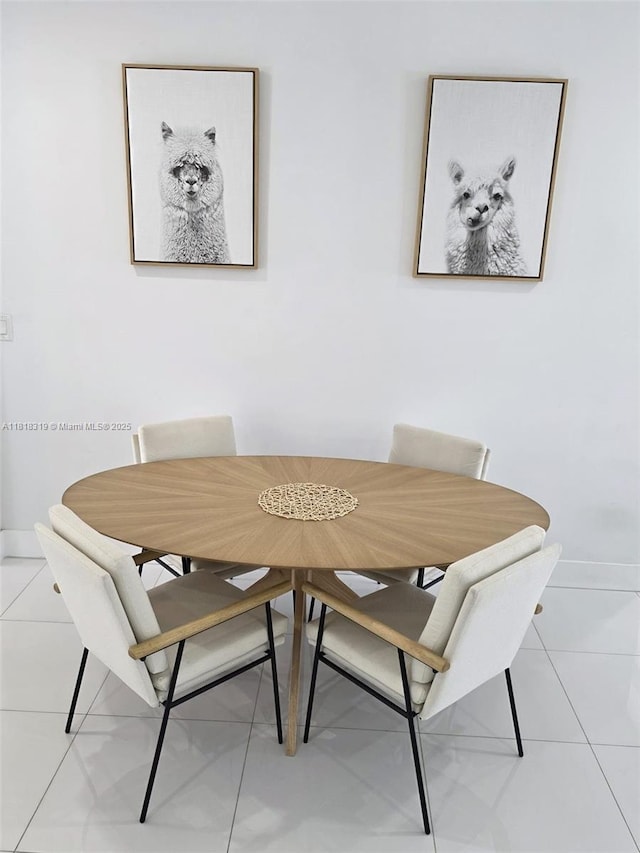 730 Alabama Ave, Fort Lauderdale, FL 33312 - dining room with light tile patterned flooring and baseboards