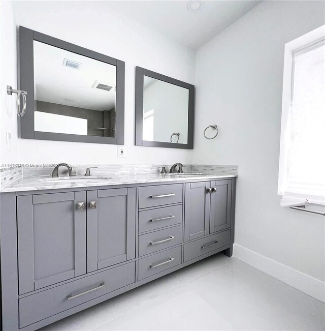 730 Alabama Ave, Fort Lauderdale, FL 33312 - bathroom with double vanity and baseboards