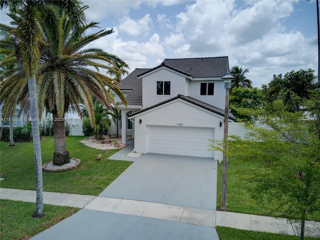 17805 NW 21st St, Pembroke Pines, FL 33029 - traditional-style home with a garage, stucco siding, a front yard, driveway, and a tiled roof