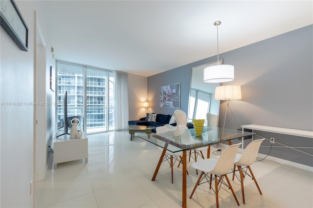 475 Brickell Ave Unit 4511, Miami, FL 33131 - dining area featuring expansive windows and baseboards