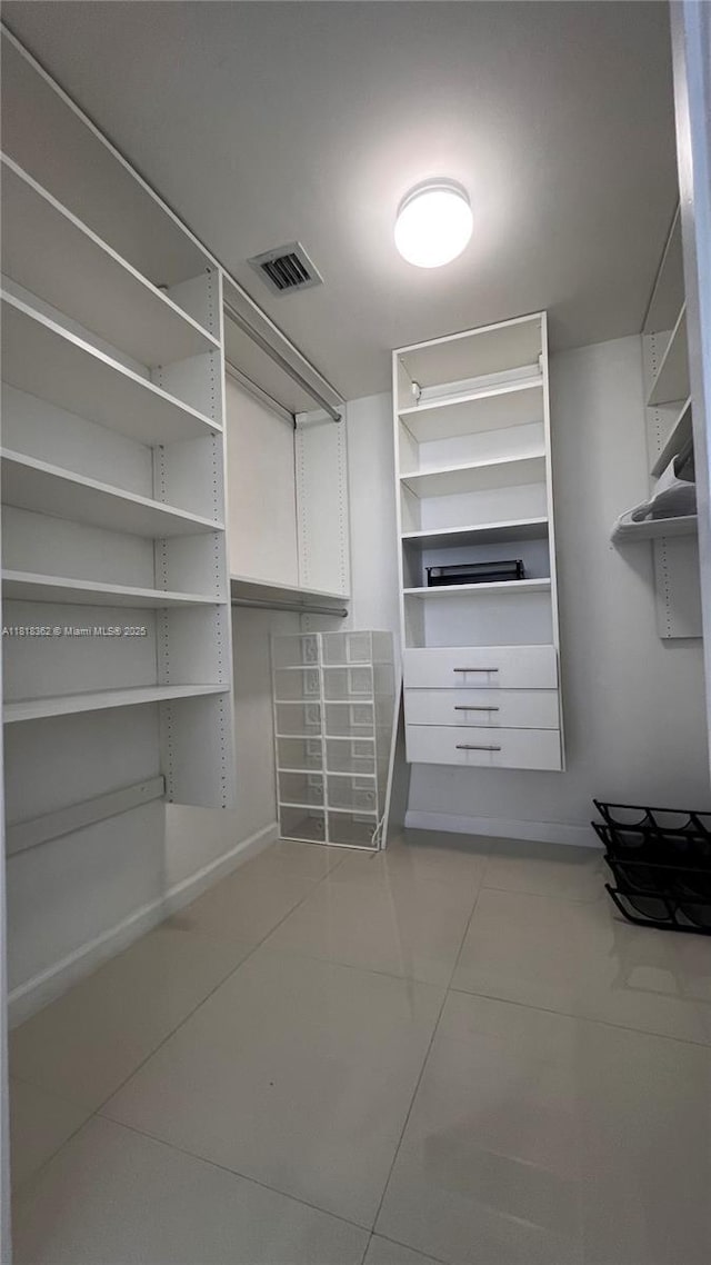 475 Brickell Ave Unit 4511, Miami, FL 33131 - walk in closet with light tile patterned floors