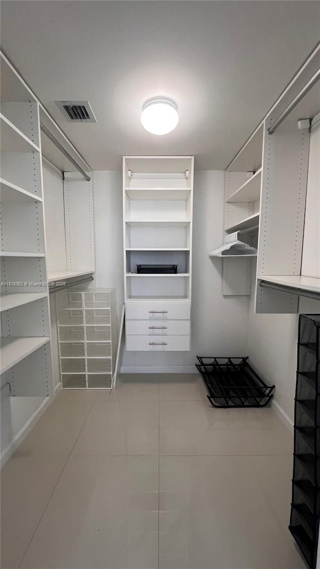 475 Brickell Ave Unit 4511, Miami, FL 33131 - walk in closet with light tile patterned flooring