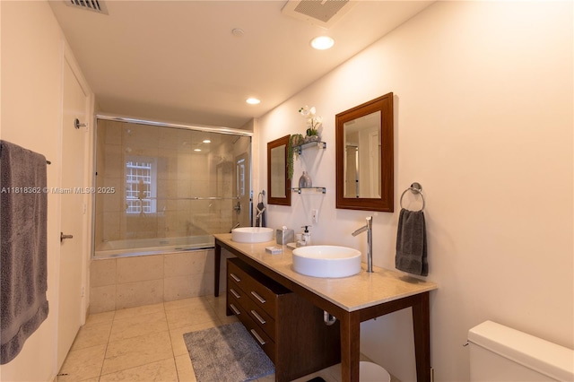 475 Brickell Ave Unit 4511, Miami, FL 33131 - bathroom with tiled shower / bath combo, double vanity, tile patterned floors, and recessed lighting