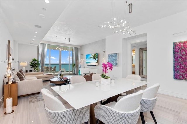17901 Collins Ave Unit 1903, Sunny Isles Beach, FL 33160 - dining room featuring a chandelier, a wall of windows, recessed lighting, baseboards, and light wood-type flooring