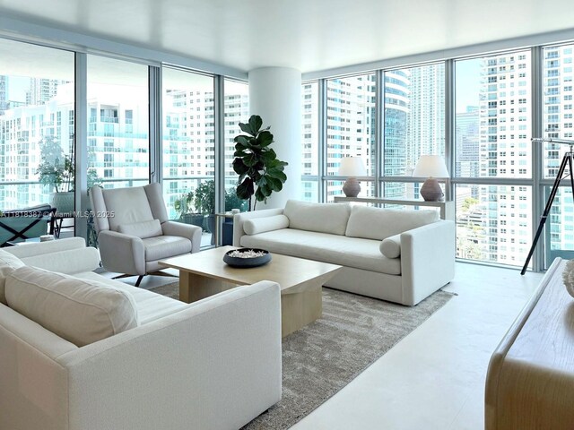 1331 Brickell Bay Dr Unit 2002, Miami, FL 33131 - living area featuring a view of city, concrete flooring, and expansive windows