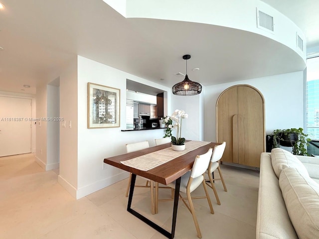 1331 Brickell Bay Dr Unit 2002, Miami, FL 33131 - dining space featuring baseboards and arched walkways