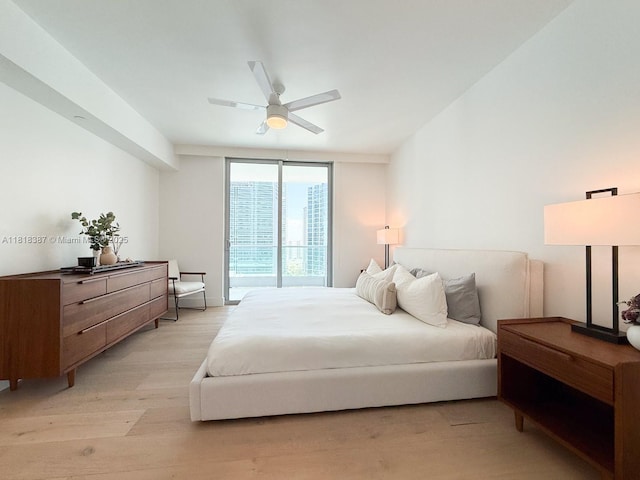 1331 Brickell Bay Dr Unit 2002, Miami, FL 33131 - bedroom with light wood-type flooring and ceiling fan