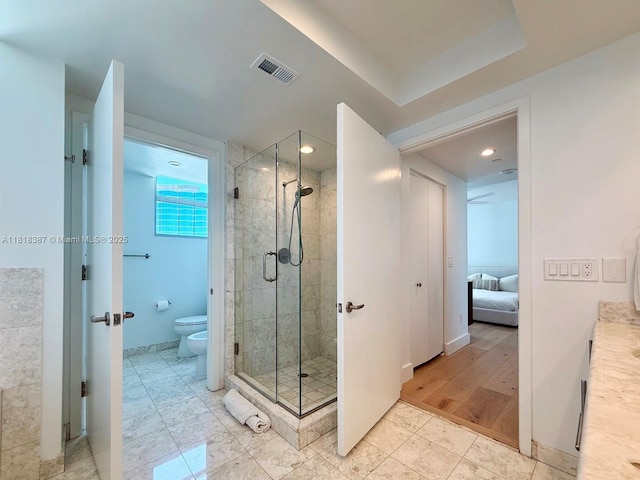 1331 Brickell Bay Dr Unit 2002, Miami, FL 33131 - ensuite bathroom featuring a shower stall, toilet, recessed lighting, and baseboards