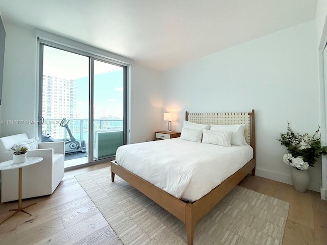 1331 Brickell Bay Dr Unit 2002, Miami, FL 33131 - bedroom with light wood-style floors, access to outside, and a city view