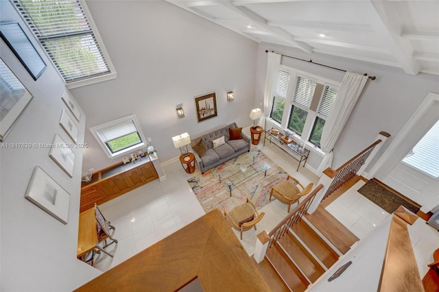 11537 SW 34th Ln, Miami, FL 33165 - living room featuring beam ceiling, coffered ceiling, baseboards, tile patterned floors, and a high ceiling